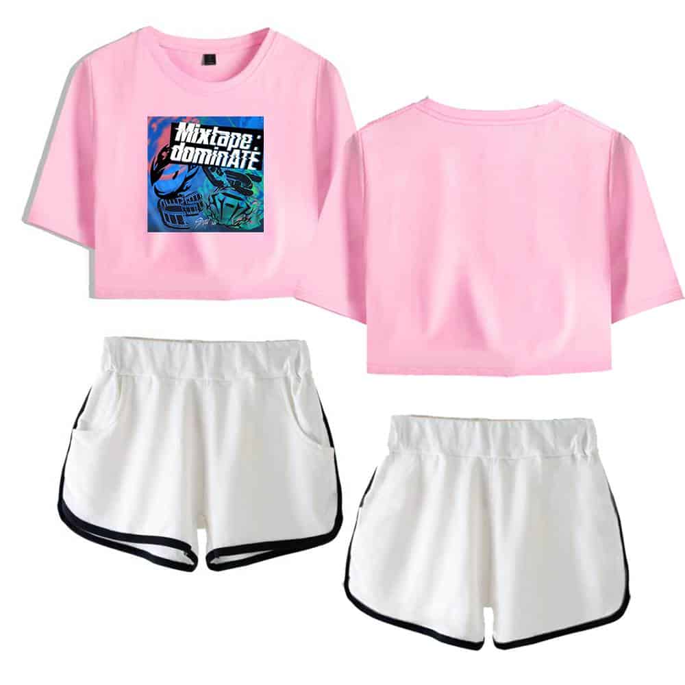 Pink Kpop merch crop top with graphic print and white sporty shorts with black trim.