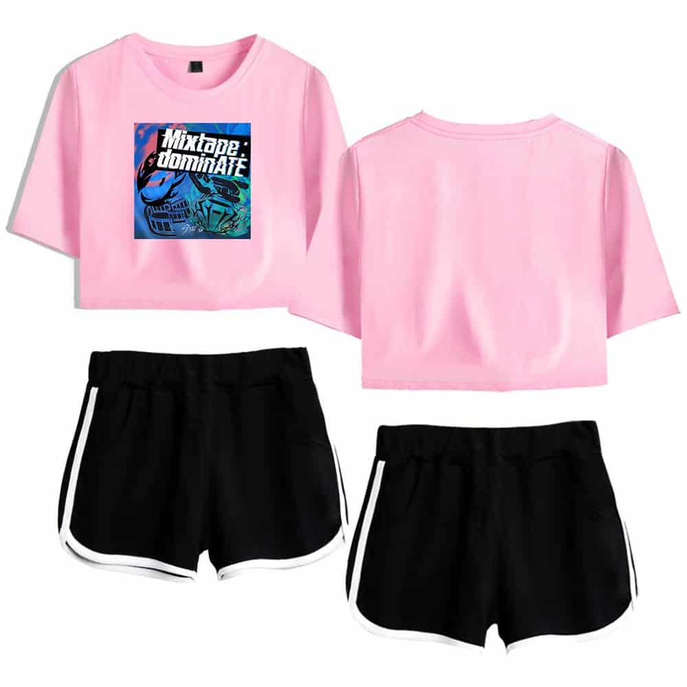 Cute pink crop top with graphic print and black athletic shorts with white trim, perfect for K-pop fan outfits.