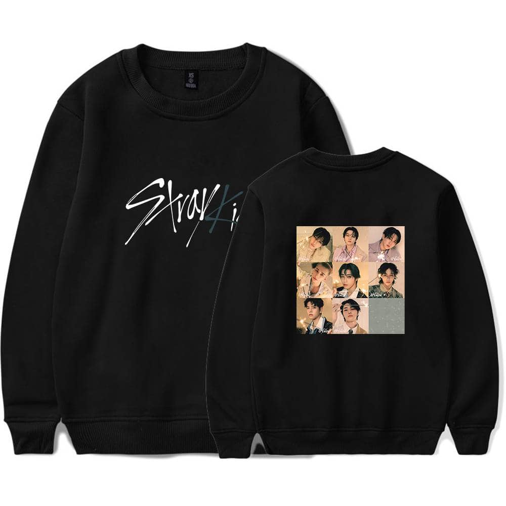 Black K-pop merchandise sweatshirt with group photos and stylish text design.