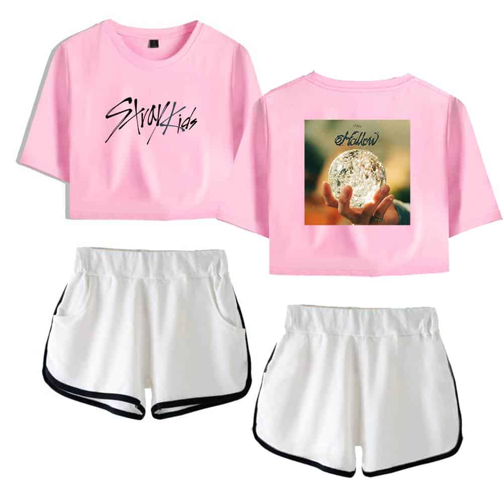 Kpop merch pink crop top with "Stray Kids" text and a white pair of shorts with black trim.