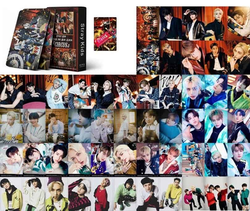 Stray Kids merchandise, including photo cards and albums with group members in various stylish outfits and settings.