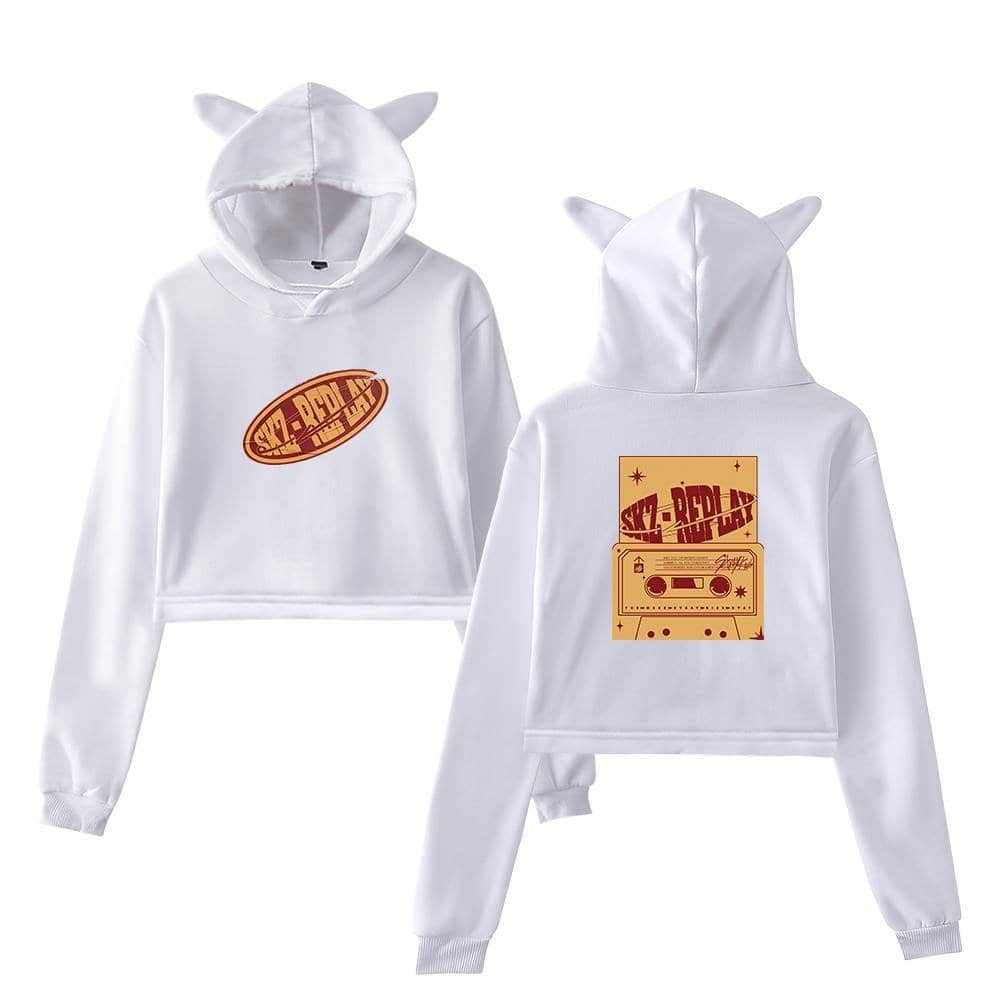 Premium white hooded sweatshirt with cute animal ears, featuring bold SKZ-PLAY logo print on front and a cassette tape graphic on the back, perfect for K-pop fans.