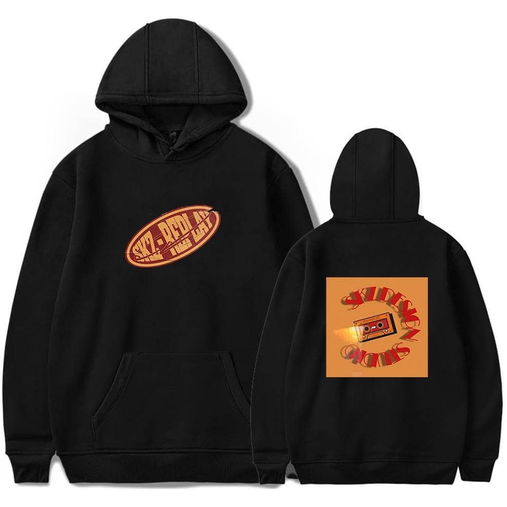 Black hoodie with SKZ RELOAD logo and retro cassette tape design, perfect for K-pop fans and merch collectors.
