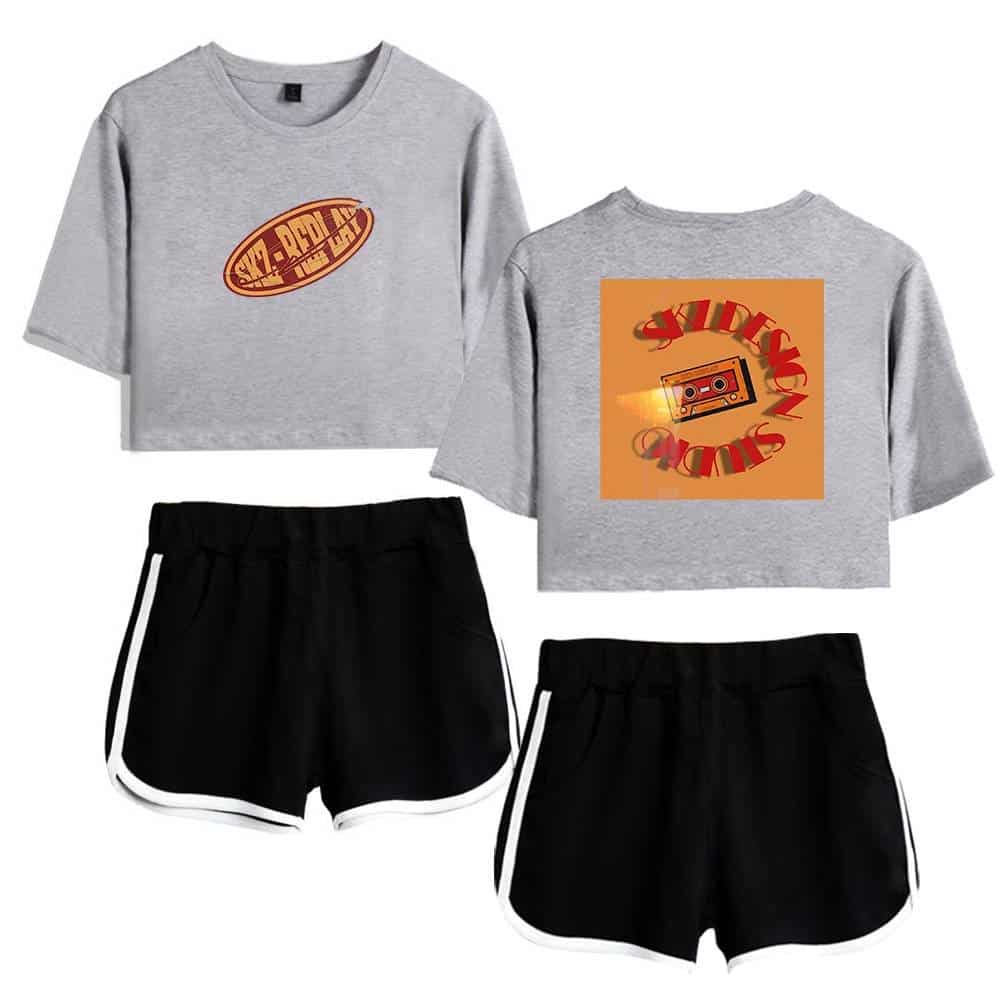 Cute gray cropped sweatshirt with retro cassette tape and "Vibe Radio" graphic design, paired with sporty black shorts with white stripes, perfect for K-pop merch fans.