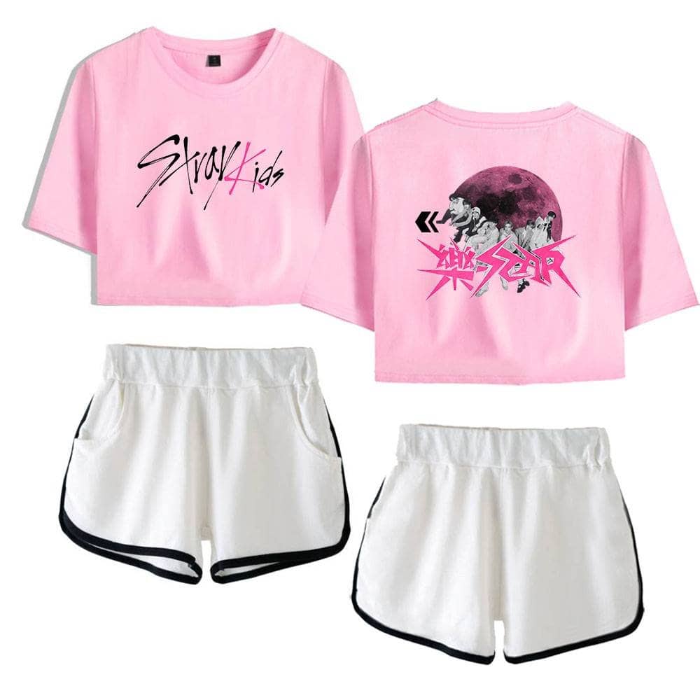 Pink K-pop girl group T-shirt with graphic design and white shorts with black trim, casual style, trendy K-pop merchandise.
