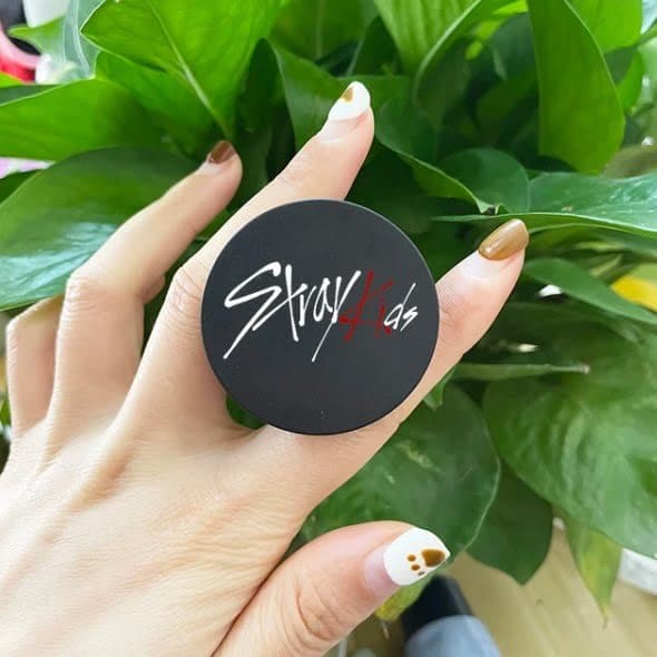 Stray Kids official merchandise in hand, featuring the group's logo and design. Perfect for K-pop fans and collectors of Kpop merch.