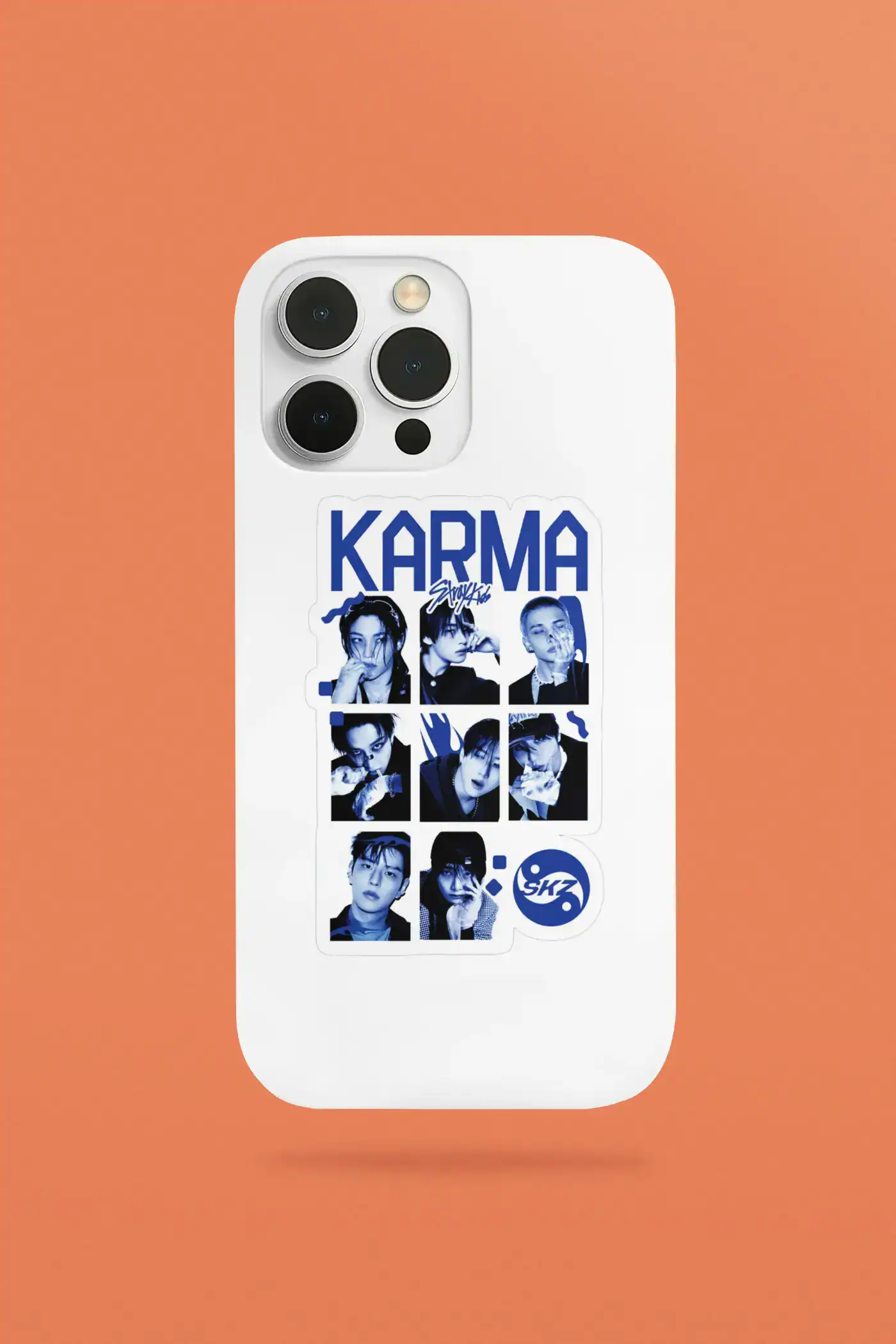 Kpop merch sticker featuring SKZ members on a white phone case with orange background.