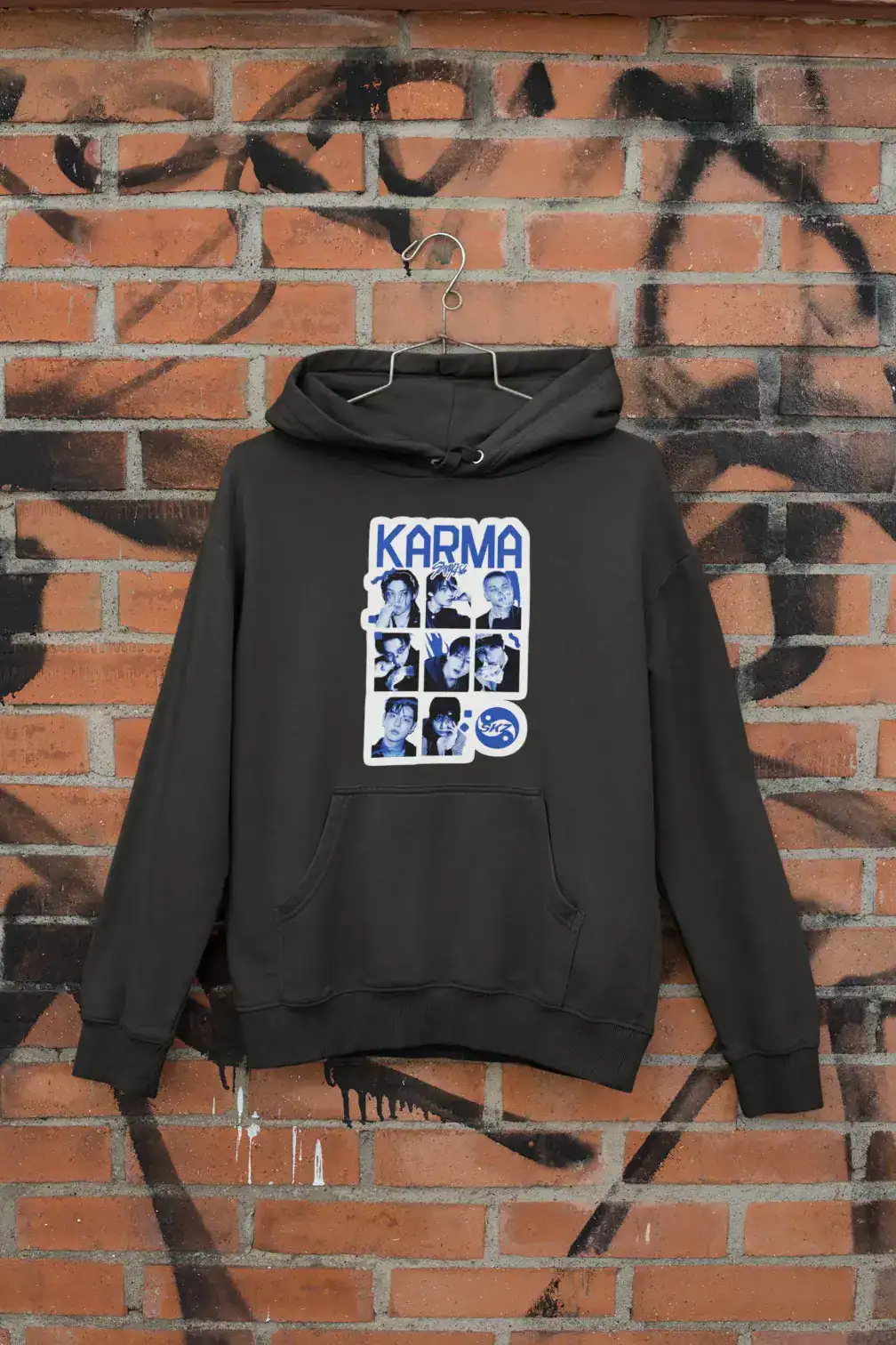Kpop merch hoodie with group members graphic and "KARMA" text.