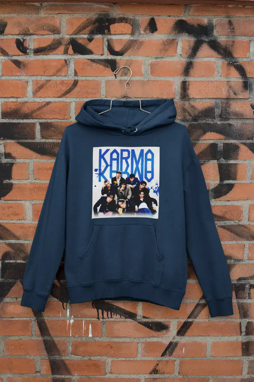 Kpop merch hoodie featuring a BTS group photo on a brick wall background.