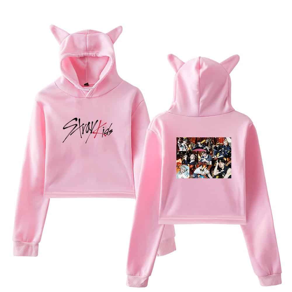 Soft pink K-pop hoodie set with cat ears, featuring a "Stray Kids" logo on the front and a group photo on the back. Perfect for fans and casual wear.