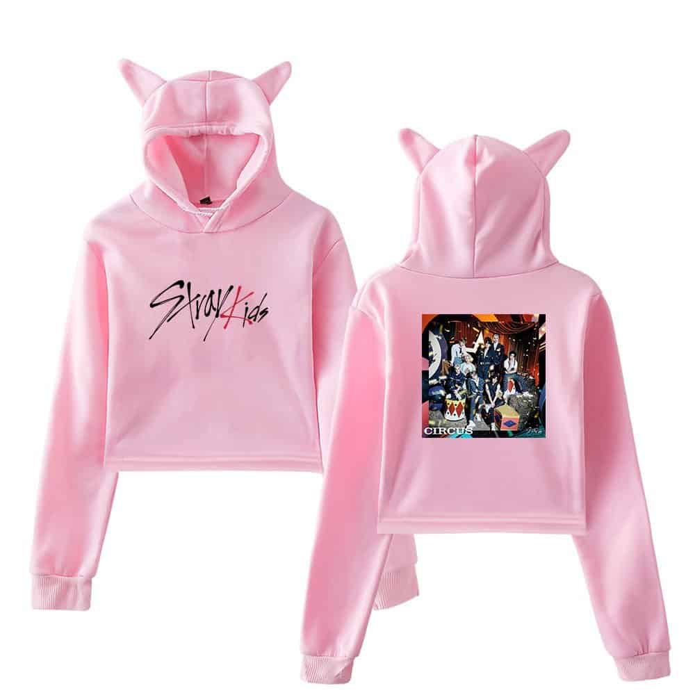 Pink K-pop hoodie with cat ears, "Stray Kids" logo on front, group photo on back, cozy and trendy merch item.